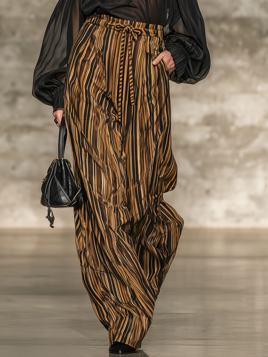 Elegant black off-the-shoulder top and striped wide-leg trousers set