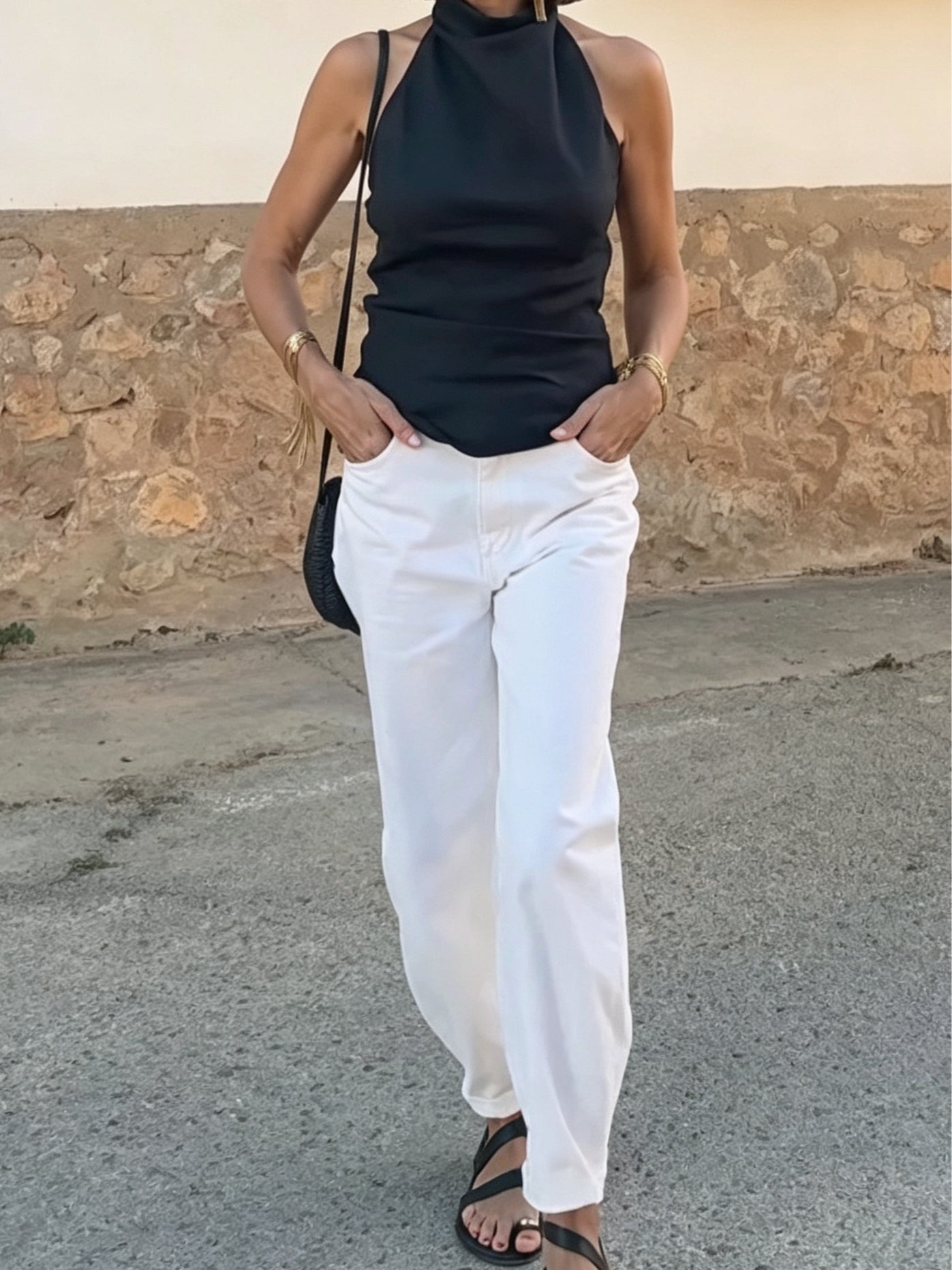 Casual black halter-neck tank top and white trousers set