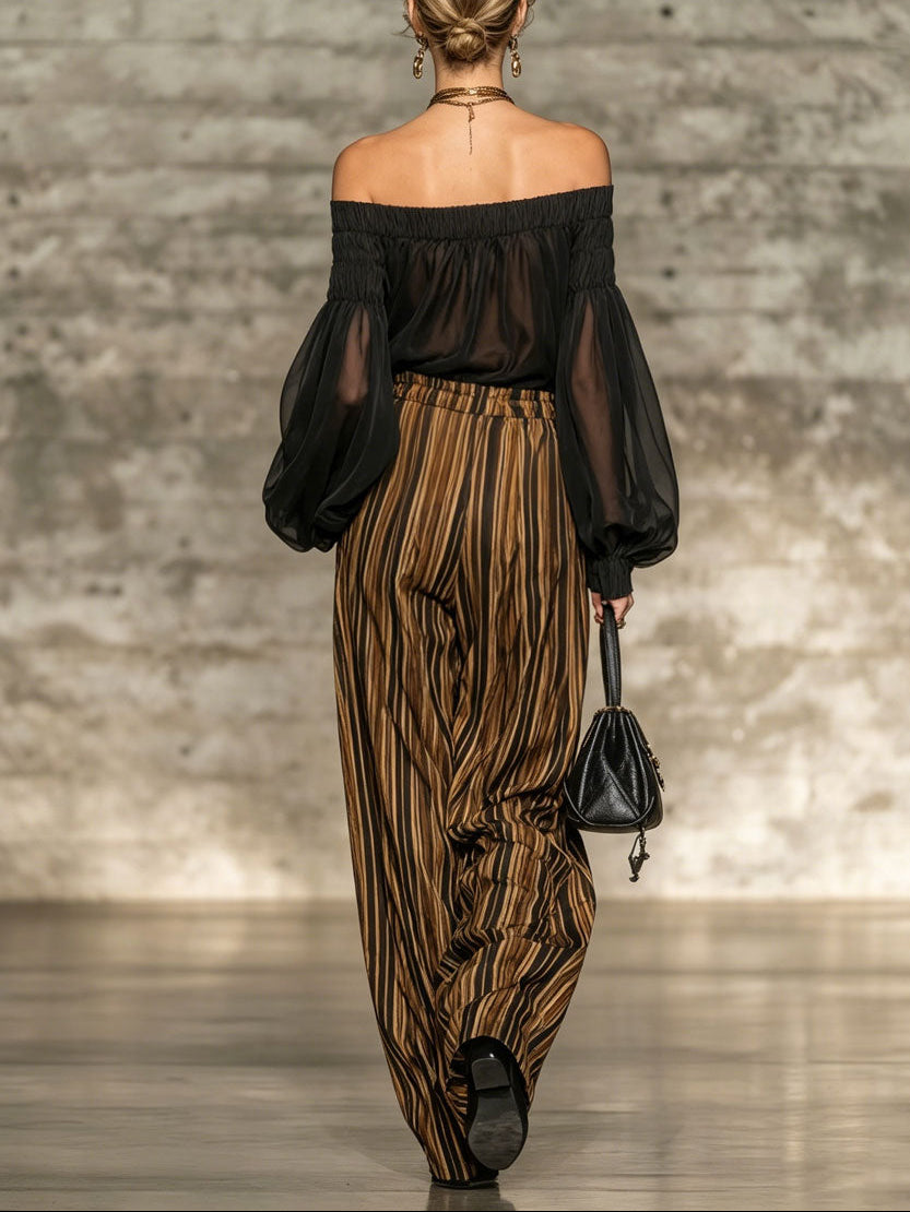 Elegant black off-the-shoulder top and striped wide-leg trousers set